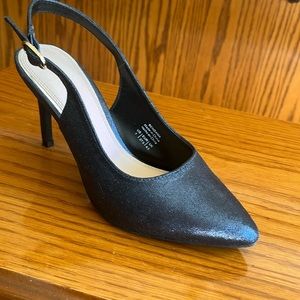 Feminine, dressy, shiny blue slingbacks in mint condition.
